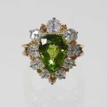 An impressive peridot and diamond ring