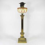 A brass column oil lamp