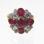 An 18 carat ruby and diamond cluster ring
