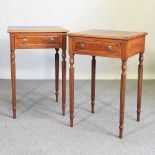 A pair of walnut side tables