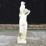 A reconstituted stone figure of a lady
