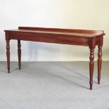 A handmade mahogany serving table