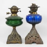 Two glass oil lamps