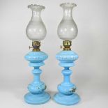 A pair of blue glass oil lamps