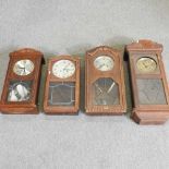 A collection of four wall clocks