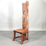 A teak high back chair