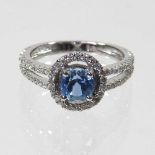 An 18 carat gold aquamarine and diamond ring