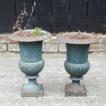 A near pair of small garden urns