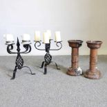 A pair of iron candelabra