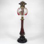 A 19th century glass oil lamp