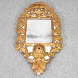 A gilt framed wall mirror