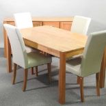 A light oak dining suite