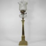 A brass column oil lamp