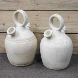 A pair of pottery ewers