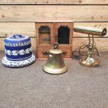 An Edwardian cabinet, lamp, bell and dome