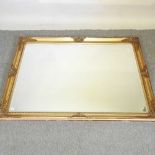 A large gilt framed wall mirror