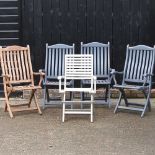 Five folding garden chairs