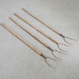 Four vintage pitch forks