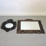 A carved oak wall mirror