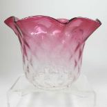 A pink glass oil lamp shade