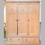 A pine triple wardrobe