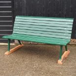 A green painted garden bench