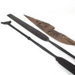 A pair of wooden paddles