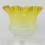 A yellow oil lamp shade