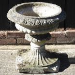 A cast stone planter