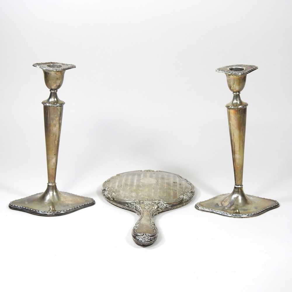 A pair of Edwardian silver candlesticks