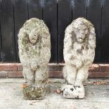 A pair of cast stone lions