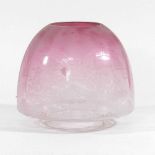 A pink oil lamp shade