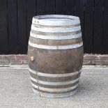 A large coopered oak barrel