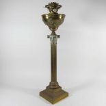 A Corinthian column oil lamp