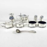 A collection of silver condiments