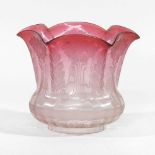 A pink glass oil lamp shade