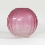 A pink glass oil lamp shade