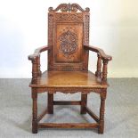 A carved oak wainscot chair