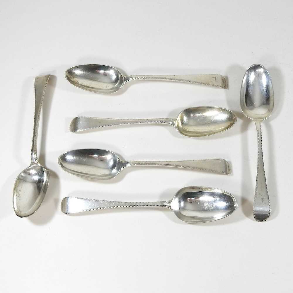 A set of six silver table spoons
