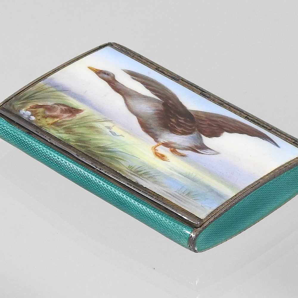 An enamelled silver cigarette case