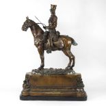 A bronze figure of a cavalryman
