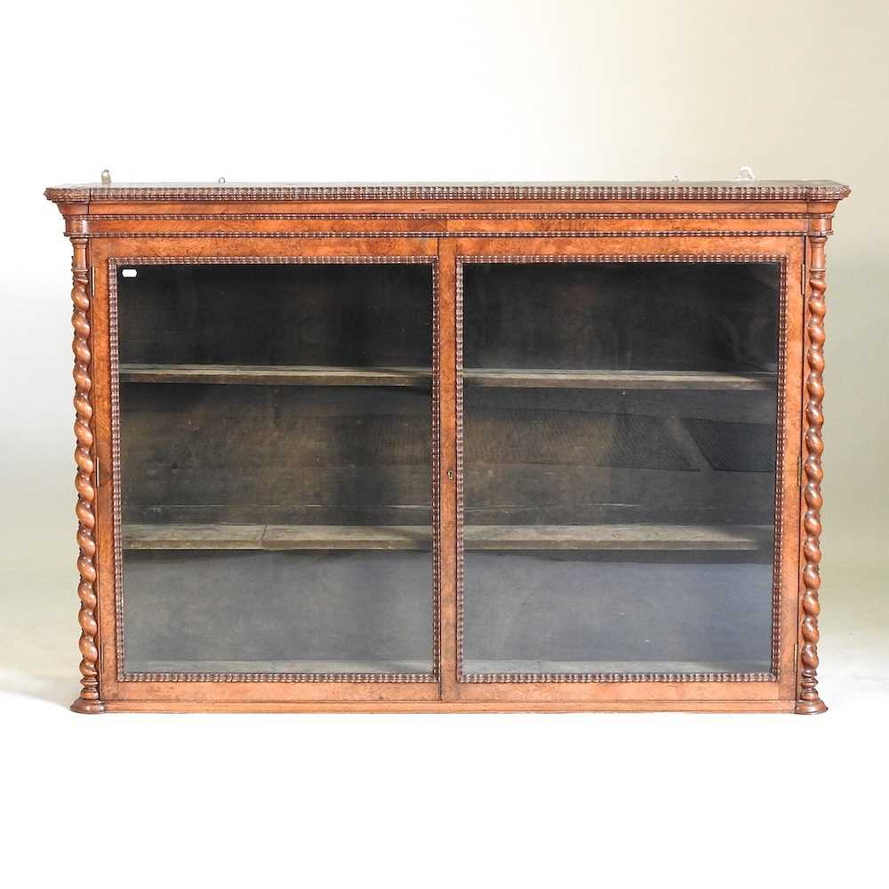 A Victorian walnut display cabinet