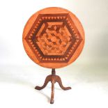 A parquetry tripod table