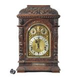 An Edwardian oak bracket clock