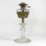 A glass and brass oil lamp base