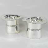 A pair of silver plated novelty wine coolers