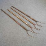 A collection of four pitch forks