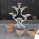 A plant stand and pots
