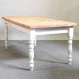 A pine and painted kitchen table