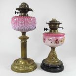 Two brass and pink glass oil lamp bases